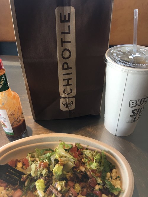 Chipotle bag, drink and burrito bowl