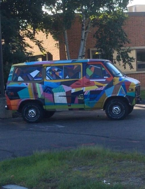 Van painted in bright multicolored geometric shapes
