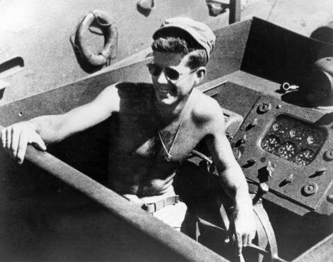 Young John F. Kennedy at the controls of a PT boat