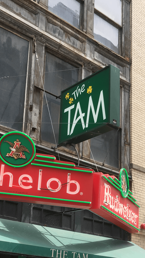The Tam bar sign with Michelob and Budweiser neon
