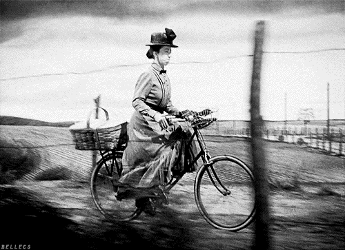 The Wizard of Oz's Miss Gulch riding her bicycle