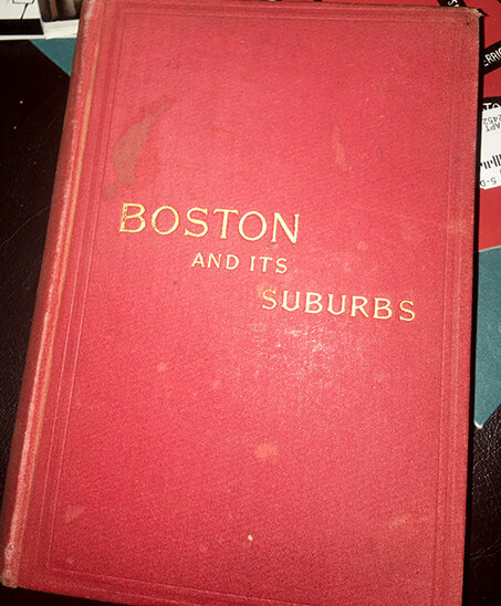 Red cloth cover of the book "Boston and Its Suburbs"