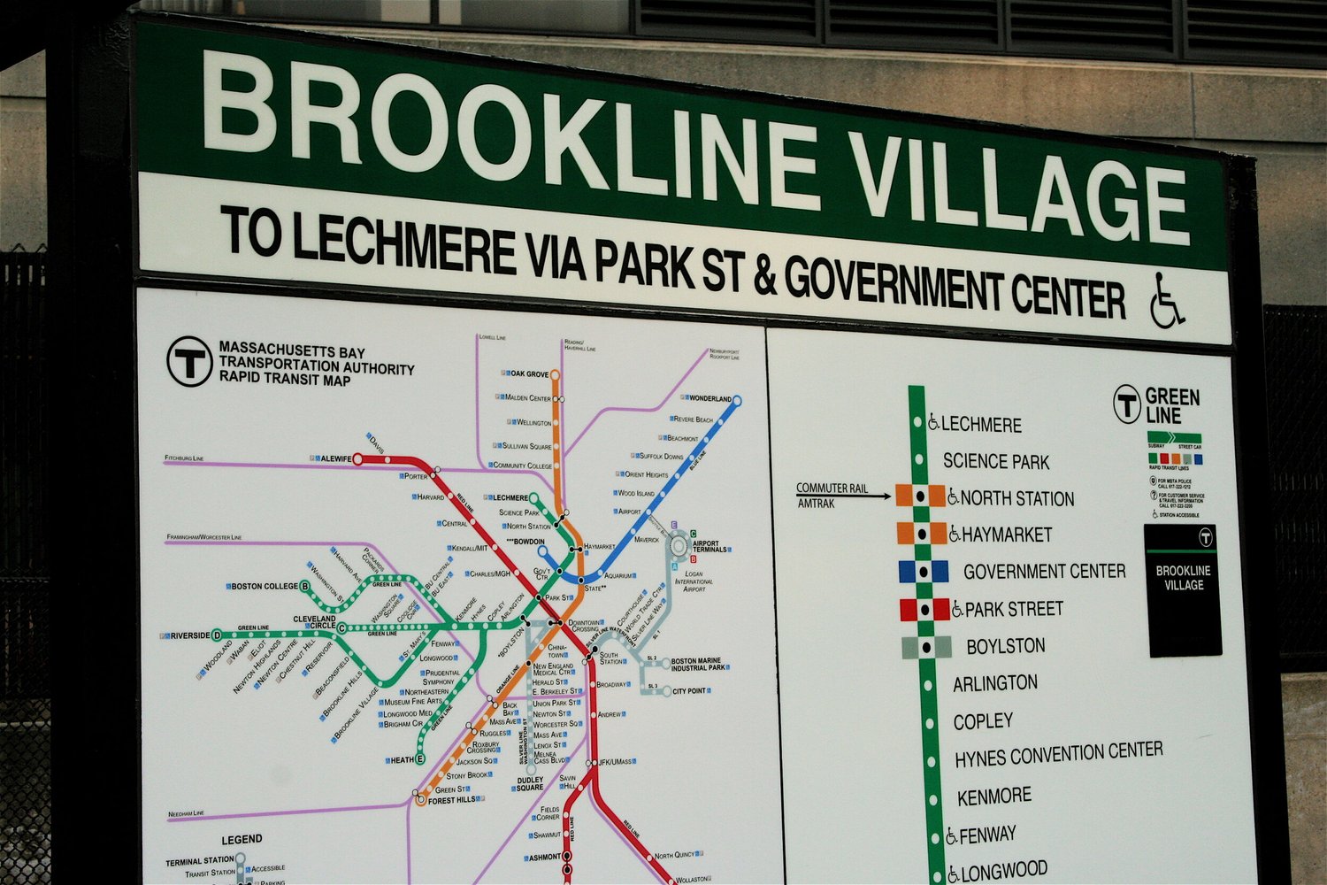 Brookline Village T station sign with a subway map