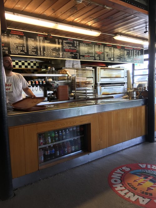 Order counter and menu boards at Anthony's pizza