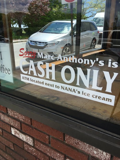 Window sign: "Sorry, Marc Anthony's is cash only"