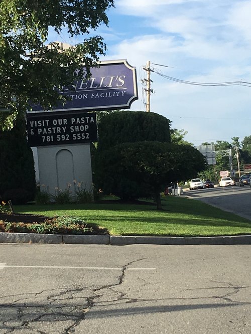 Pastry and pasta shop sign by a road