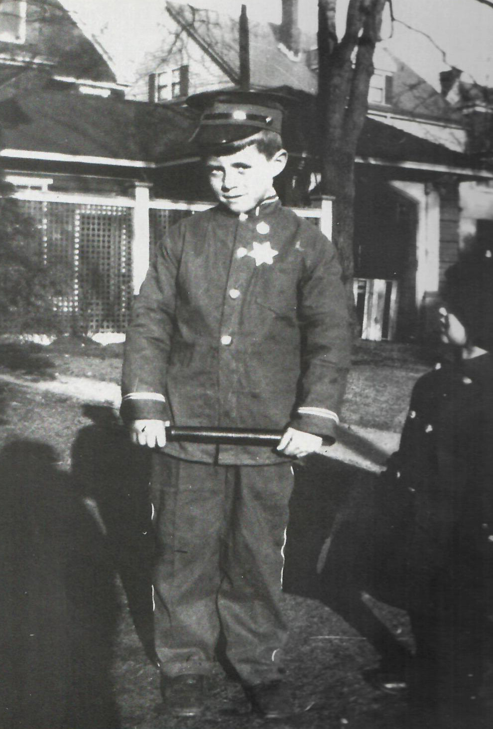 John F. Kennedy, about age 9, in Halloween costume behind Abbotsford Road home (Courtesy John F. Kennedy Library & “Images of America: Brookline,” Hardwicke and Reed, 1998)