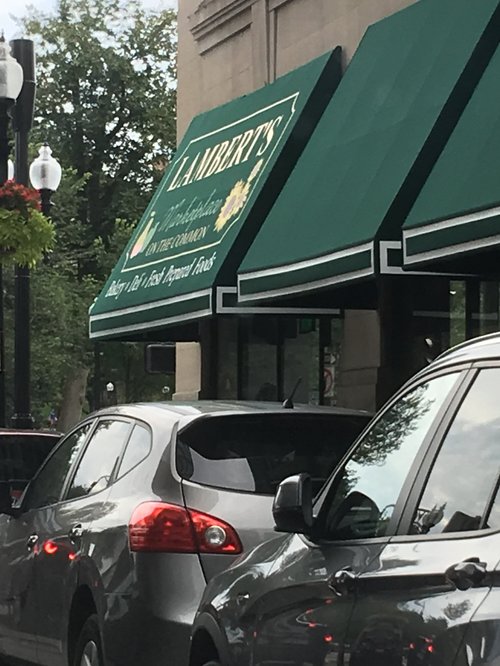 Lambert's market with green awnings