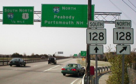 Highway signs for I-95 North and Route 128 North and South