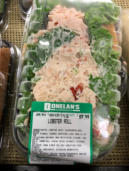 Packaged Donelan's lobster roll with price label