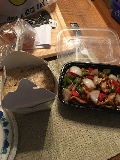 Chinese takeout: rice and a stir-fry with peppers and onions