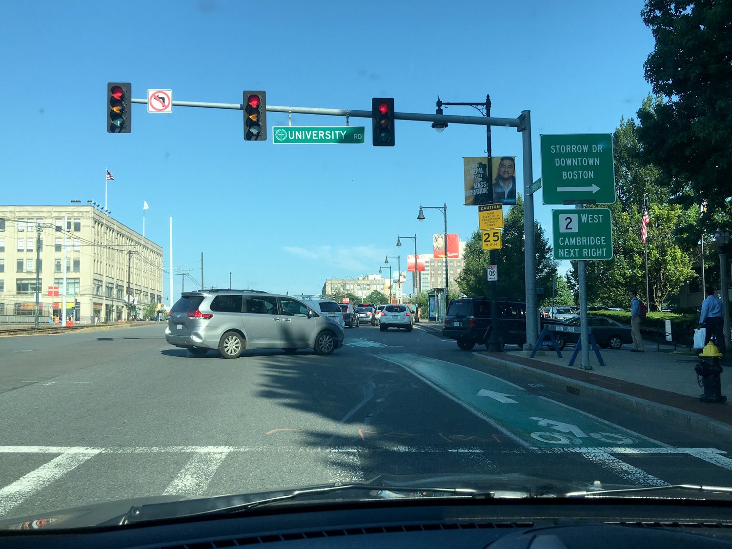 Busy intersection on Commonwealth Avenue seen from the driver's seat