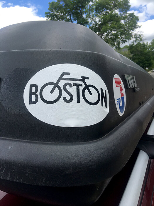 "Boston" bicycle sticker on a car roof box