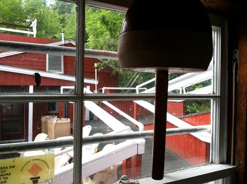 View through a window to a red lobster shack and its deck