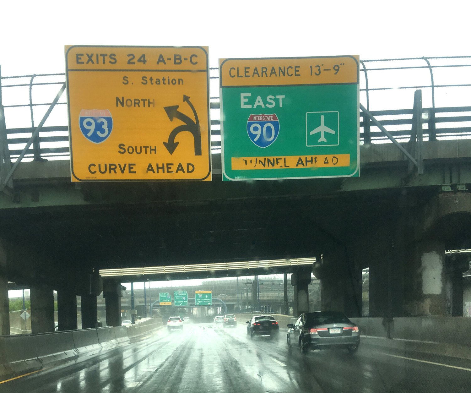 Overhead signs for I-93 and I-90 East to Logan Airport