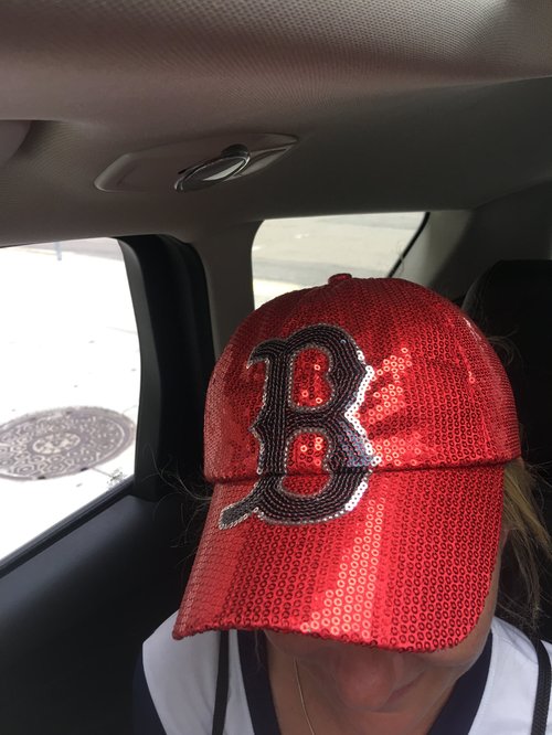 Rider in a red sequined Red Sox cap