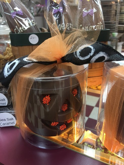 Chocolate pumpkin in a gift jar with an orange Halloween bow