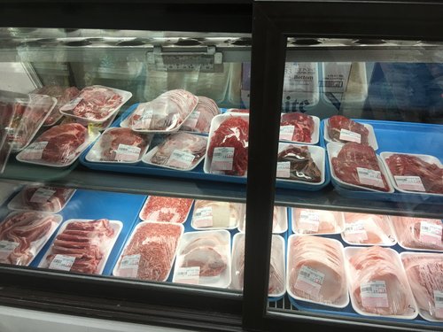 Meat case with packaged cuts of meat