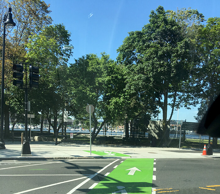 Green-painted bike lane at a city intersection