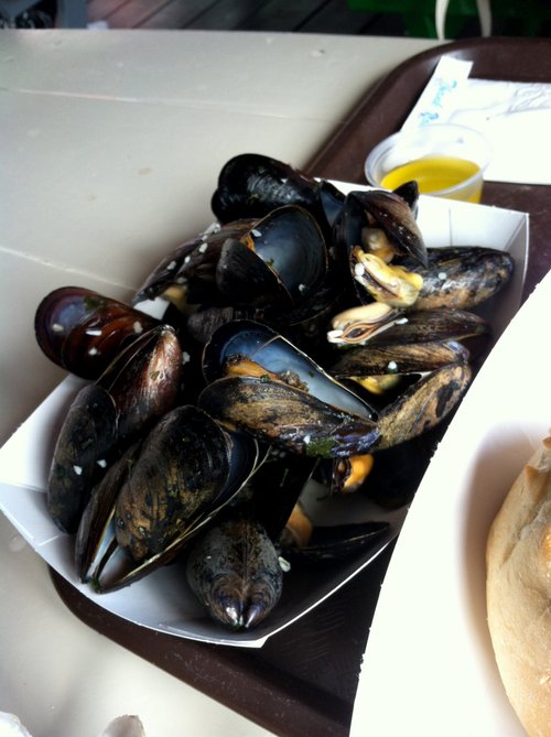 Steamed mussels in a paper boat