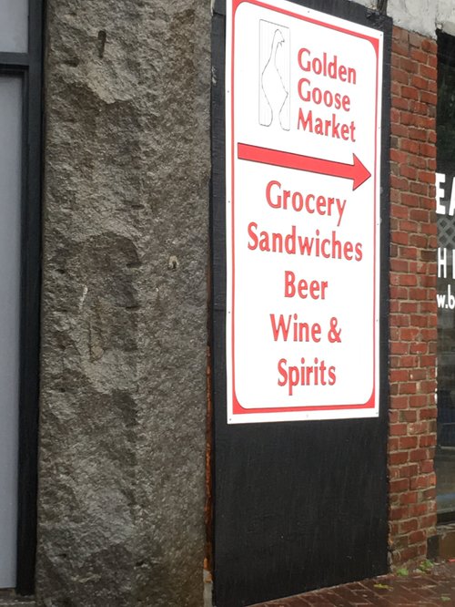 Golden Goose Market sign: grocery, sandwiches, beer, wine and spirits