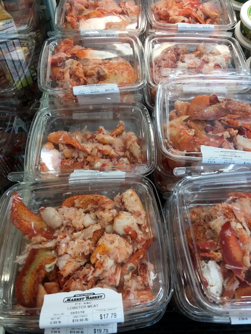 Packaged lobster meat in a Market Basket case
