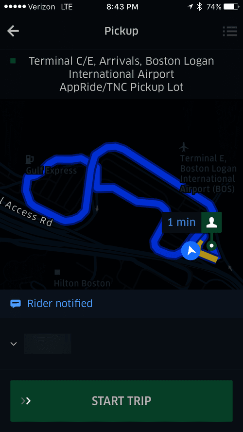 Uber pickup screen at the Logan Airport rideshare lot