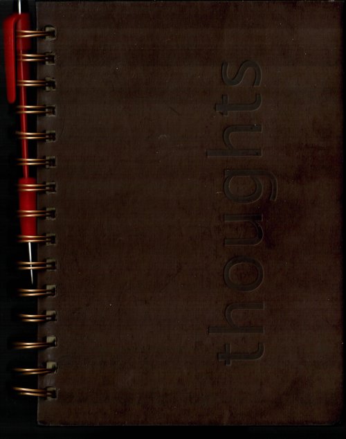 Brown spiral notebook embossed "thoughts", the in-car rider journal